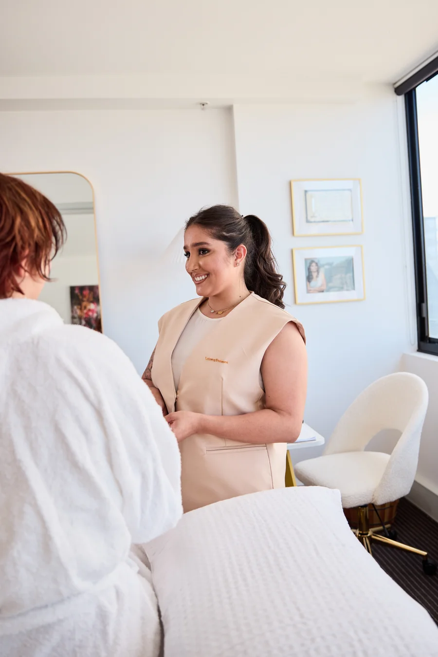 Loiany with a client in the private treatment room at La Bella, Sydney skyline view